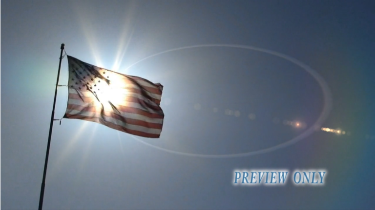 Read more about the article US Flag Waving and Sun Flare: Patriotic Loop