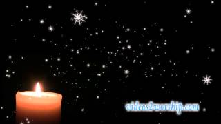 Burning Candle And Falling Snow